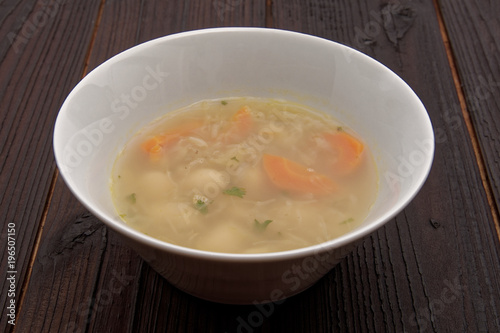 Cabbage soup with vegetables on a table