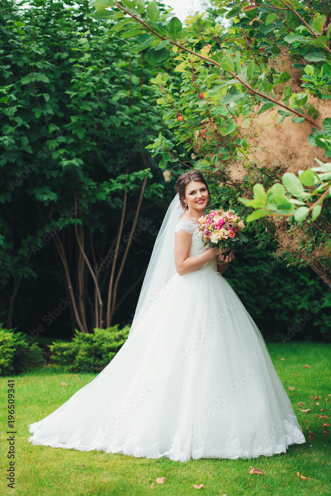 Happy bride with bouquet