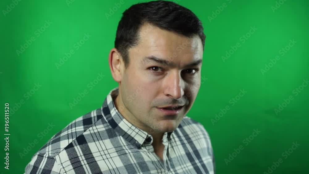 man in a suit looking through a magnifying glass is amazed green screen background man in a suit looking through a magnifying glass is amazed green screen background