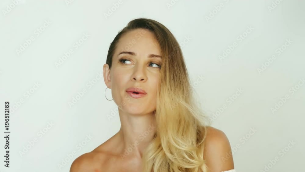 Happy woman dancing and looking into camera on white background Happy woman dancing and looking into camera on white background