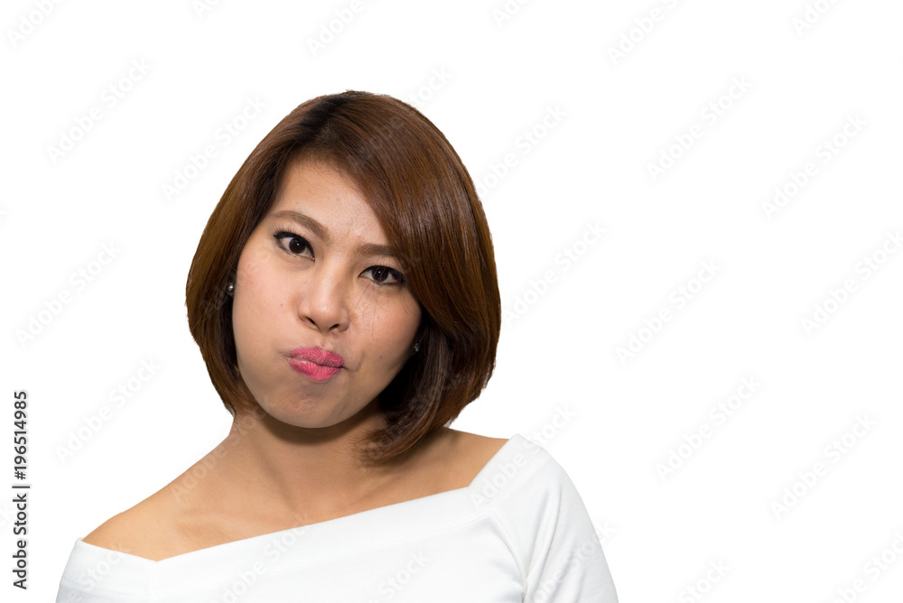 Adorable young female with appealing appearance puffing out her cheeks while standing over white background. clipping path.