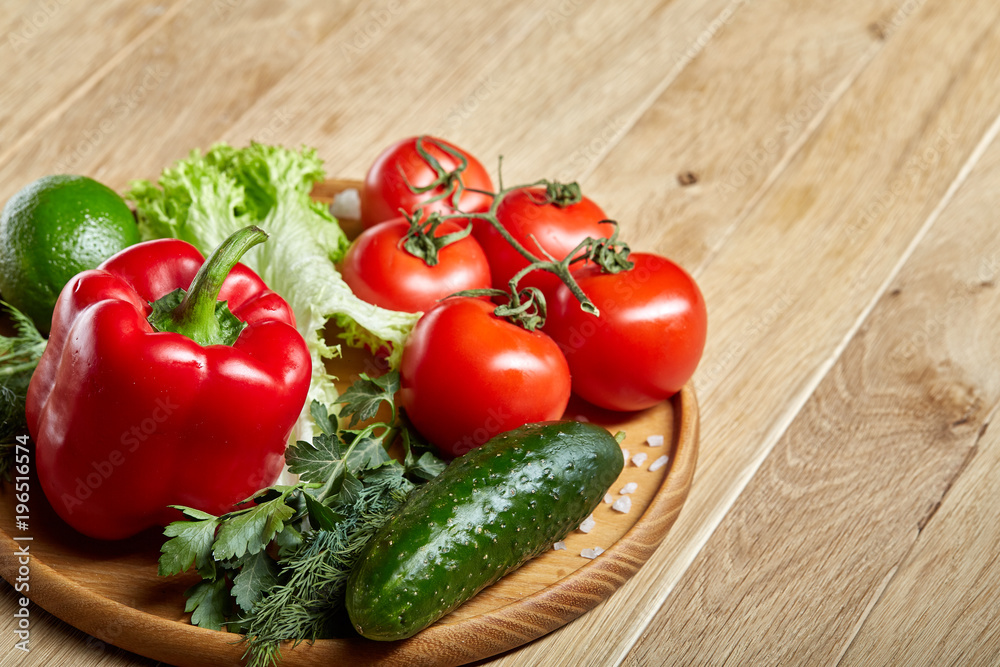 Artistic still life of assorted fresh vegetables and herbs on rustic wooden background, top view, selective focus. Artistic still life of assorted fresh vegetables and herbs on rustic wooden background, top view, selective focus.