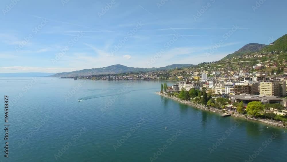 4K Swiss City aerial shot. Scenic panorama of a beautiful town by the lake 4K Swiss City aerial shot. Scenic panorama of a beautiful town by the lake