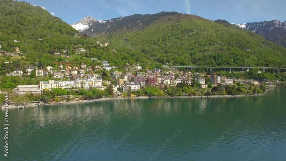 4K Swiss riviera aerial shot. Flying toward Montreux, Switzerland. Peaceful town by the lake 4K Swiss riviera aerial shot. Flying toward Montreux, Switzerland. Peaceful town by the lake