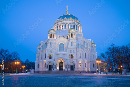 Fototapeta Naklejka Na Ścianę i Meble -  Nikolsky Sea Cathedral in the Anchor Square close-up in the March twilight. Kronstadt, Russia