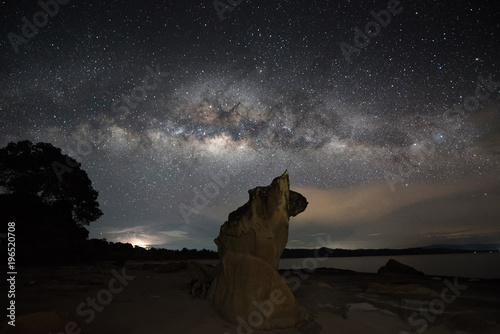 milkyway galaxy and rise above an unknown Beach at Kudat, Malaysia.