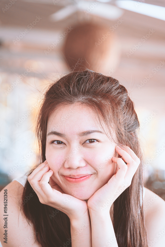 Beautiful asian woman has happy and laughing in the bar and restaurant for dinner in the evening and sun lighting with relaxing and vacation time. Beautiful asian woman has happy and laughing in the bar and restaurant for dinner in the evening and sun lighting with relaxing and vacation time.