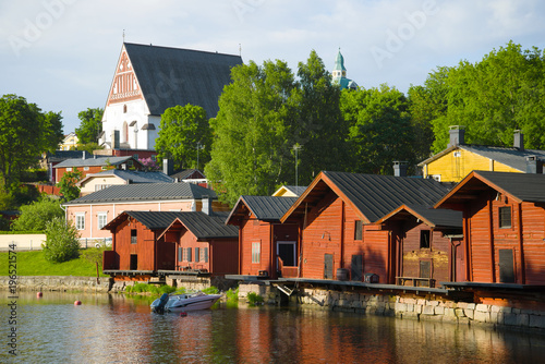 The old embankment and the Lutheran Cathedral in the June evening. Porvoo, Finland