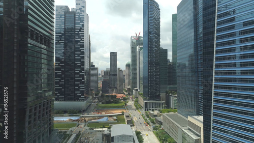 Photography AERIAL: Spectacular aerial shot of flying between soaring glassy skyscrapers