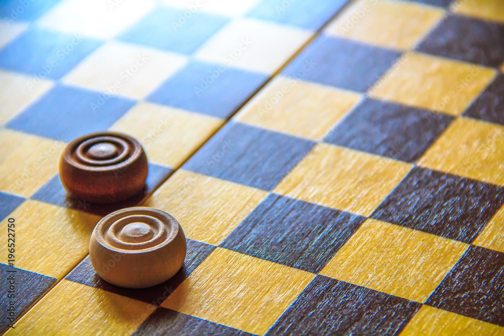 Dark and light checkers on a chessboard. Opposition of good and evil.