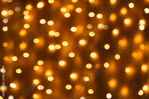 Texture from the blurred yellow circles in bokeh style for design. Defocused lights of the city.