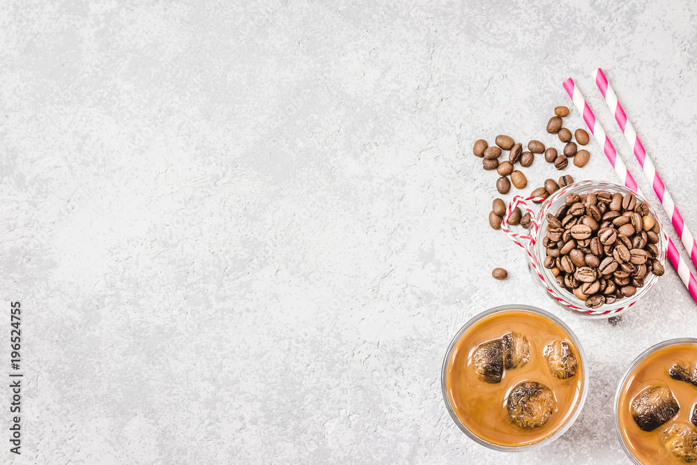 Iced cinnamon coffee on concrete background. Top view, copy space. Iced cinnamon coffee on concrete background. Top view, copy space.