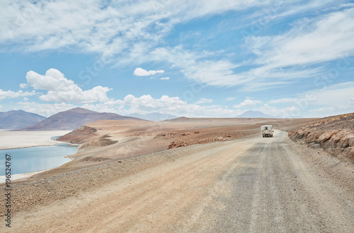 Recreational vehicle on empty road, Chiguana, Potosi, Bolivia, South America photo