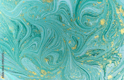 Marble abstract acrylic background. Nature blue marbling artwork texture. Golden glitter.