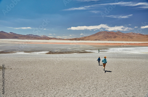 Mother and sons exploring landscape, Laguna Colorada, Colorada, Potosi, Bolivia, South America