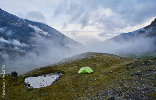 Mountain view with tent on hill, Ventilla, La Paz, Bolivia, South America photo