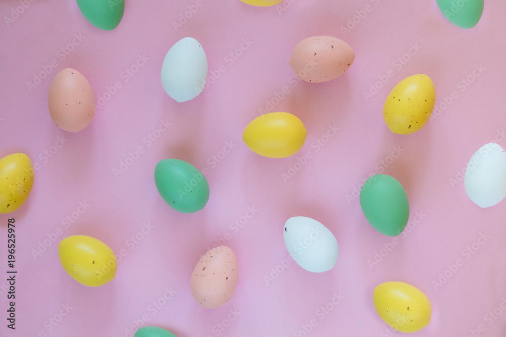 Colorful easter eggs on pink background, easter symbols Colorful easter eggs on pink background, easter symbols