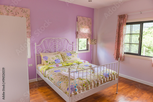 Interior of modern bedroom with Parquet floors on a sunny day colorful bedroom style