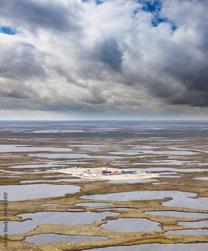 Fototapeta premium Oil rig on swamp, top view