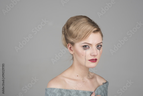 Canvas Print Girl cry with mascara streams on face. Lady with hair