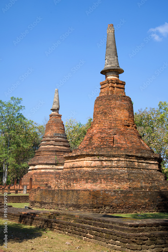 Two prangs on the ruins of the ancient Buddhist temple Wat Phra That. Kamphaeng Phet, Thailand Two prangs on the ruins of the ancient Buddhist temple Wat Phra That. Kamphaeng Phet, Thailand