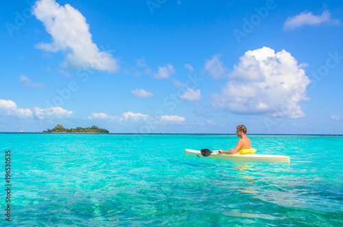 Kayaking in tropical paradise - Canoe floating on transparent turquoise water  caribbean sea  Belize  Cayes islands