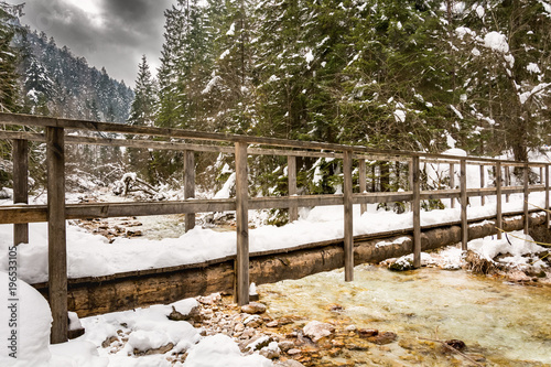 Wooden bridge over Triglav Bistrica (creek) near Pricnik waterfall photo