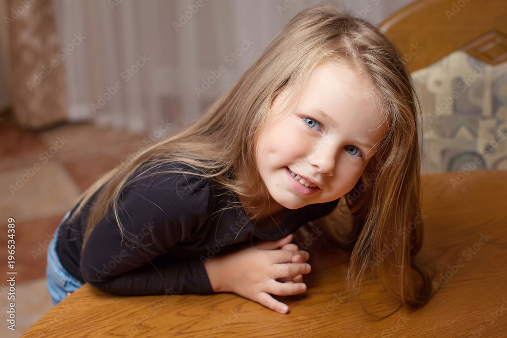 Portrait of the beauyiful smiling little girl
