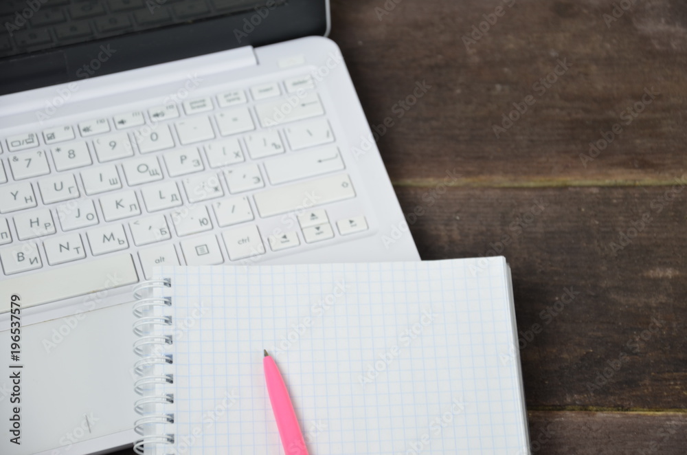 Laptop notebook and pencil on a wooden table Laptop notebook and pencil on a wooden table