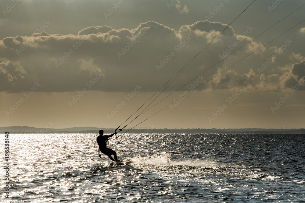 A man riding kite - kite surfing A man riding kite - kite surfing