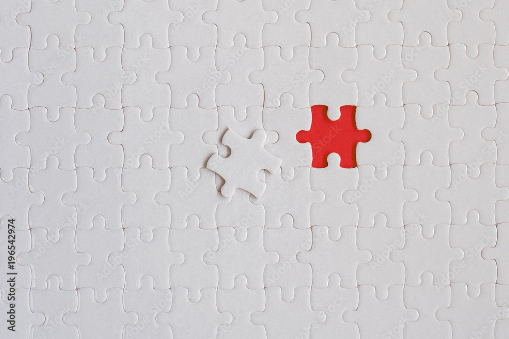 © BigNazik - White details of jigsaw puzzle on red background © BigNazik - White details of jigsaw puzzle on red background