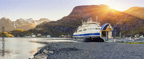 Ferry arrival and unloading in Moskenes, Lofoten Islands, Norway photo