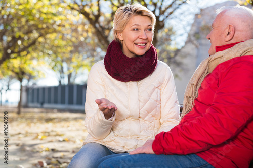 Mature couple talking in park