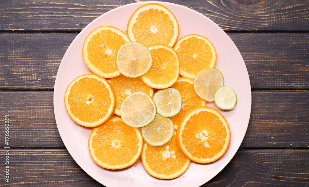 citrus slices on a wooden background citrus slices on a wooden background