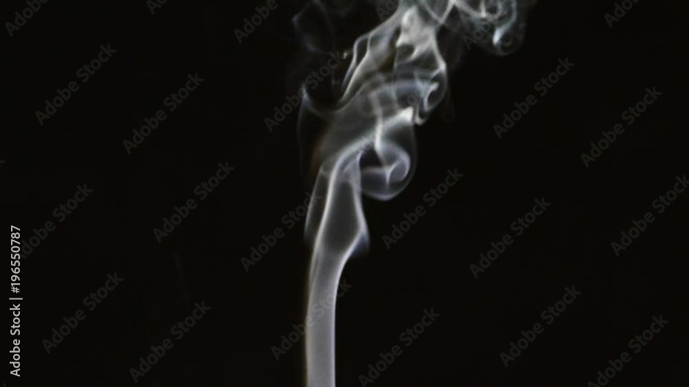 Beautiful gray smoke on a black background. Cigarette smoke. Smoke from the hookah. Turbulence of smoke. The white vapor rises. The smoke slowly flies. Beautiful gray smoke on a black background. Cigarette smoke. Smoke from the hookah. Turbulence of smoke. The white vapor rises. The smoke slowly flies.
