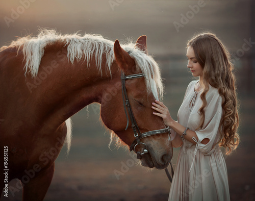 girl with horse at sunset