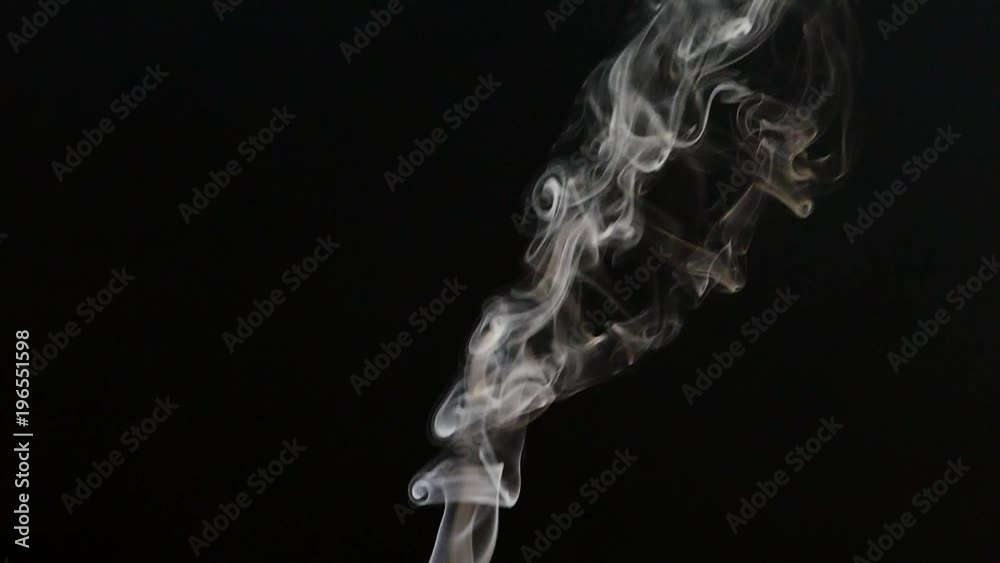 Beautiful gray smoke on a black background. Cigarette smoke. Smoke from the hookah. Turbulence of smoke. The white vapor rises. The smoke slowly flies. Beautiful gray smoke on a black background. Cigarette smoke. Smoke from the hookah. Turbulence of smoke. The white vapor rises. The smoke slowly flies.