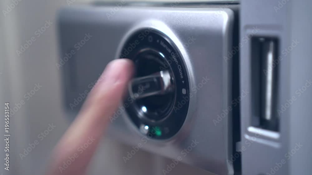 Close-up - the hand put the automatic lock door for open a door in building Close-up - the hand put the automatic lock door for open a door in building