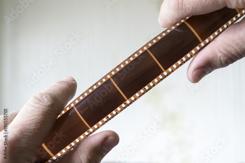Old film in male hands.