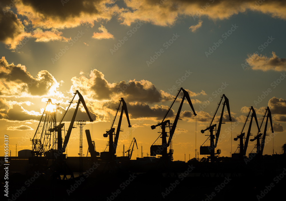 Port cranes in the sunset