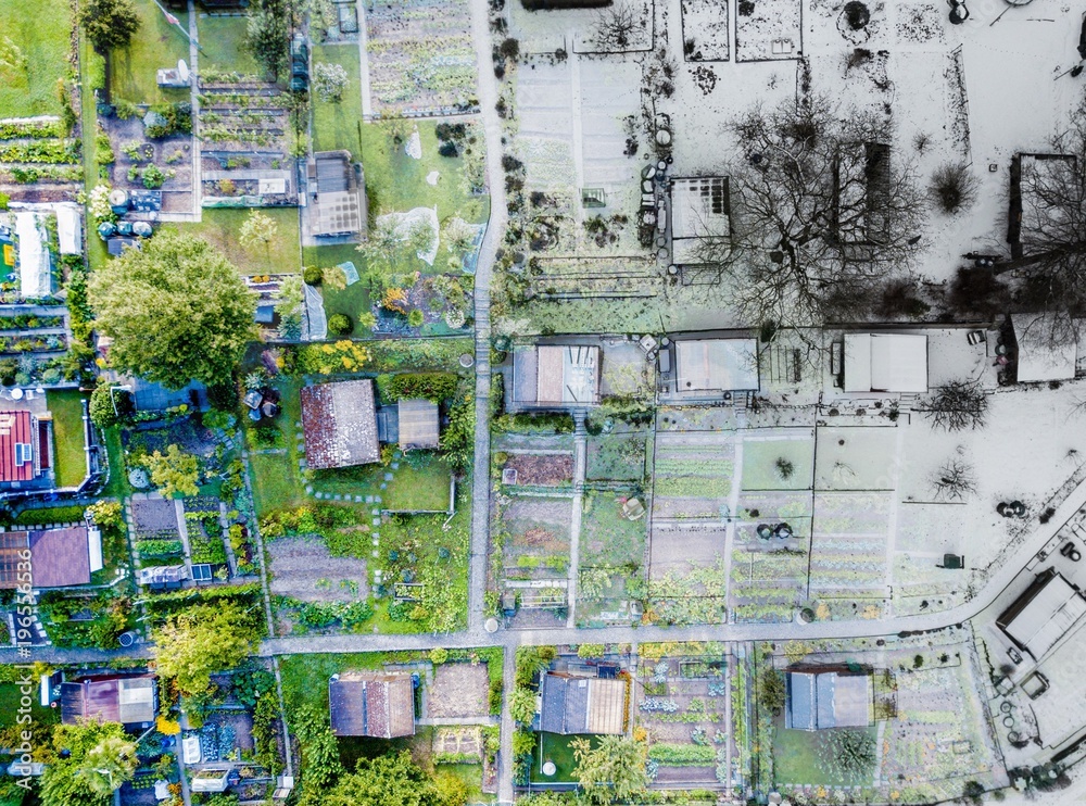 Aerial view of allotments in summer and winter. Photoshop montage of two different seasons with fade between summer and winter. Symbolizes change throughout the year in a eye-catching birds eye view. Aerial view of allotments in summer and winter. Photoshop montage of two different seasons with fade between summer and winter. Symbolizes change throughout the year in a eye-catching birds eye view.