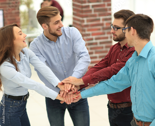 Group of people hands together partnership teamwork.