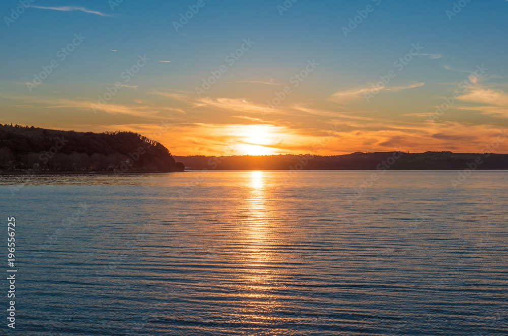 Anguillara Sabazia, Italy - The Bracciano lake at sunset from the old stone town on the waterfront named Anguillara Sabazia, province of Rome, central italy