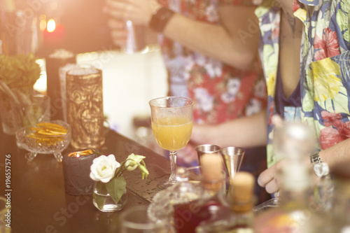 Barman is making cocktails during the party