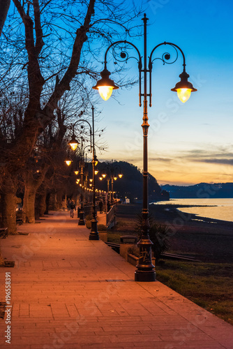 Anguillara Sabazia, Italy - The Bracciano lake at sunset from the old stone town on the waterfront named Anguillara Sabazia, province of Rome, central italy
