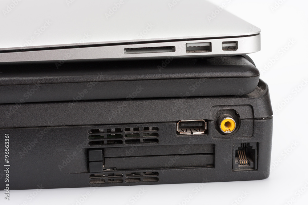 Comparing of laptops, new modern and old laptop, present and past Comparing of laptops, new modern and old laptop, present and past