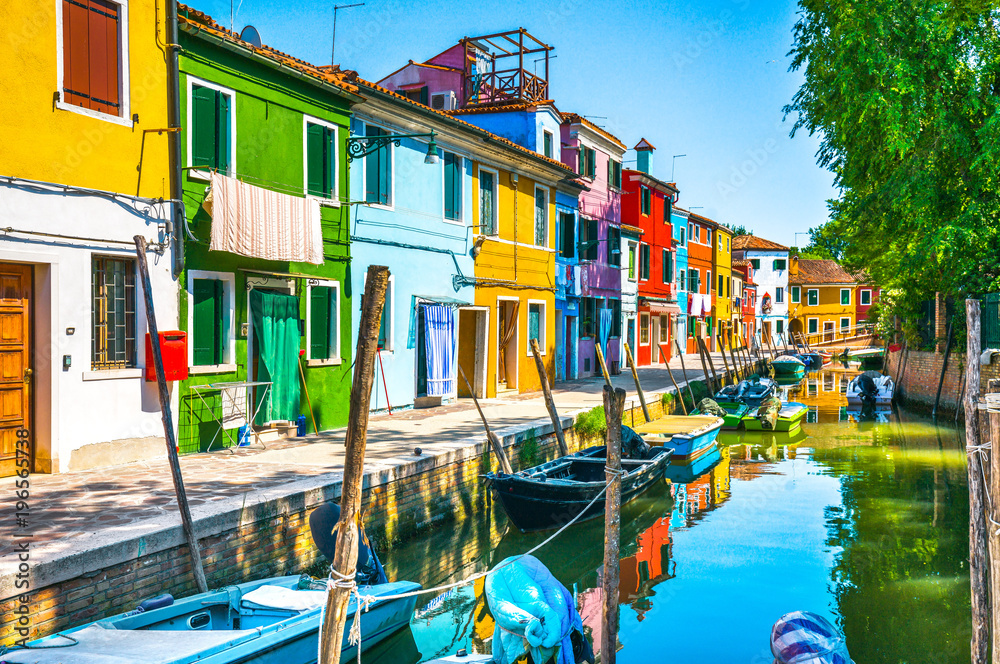 Burano island canal, colorful houses and boats,Venice, Italy