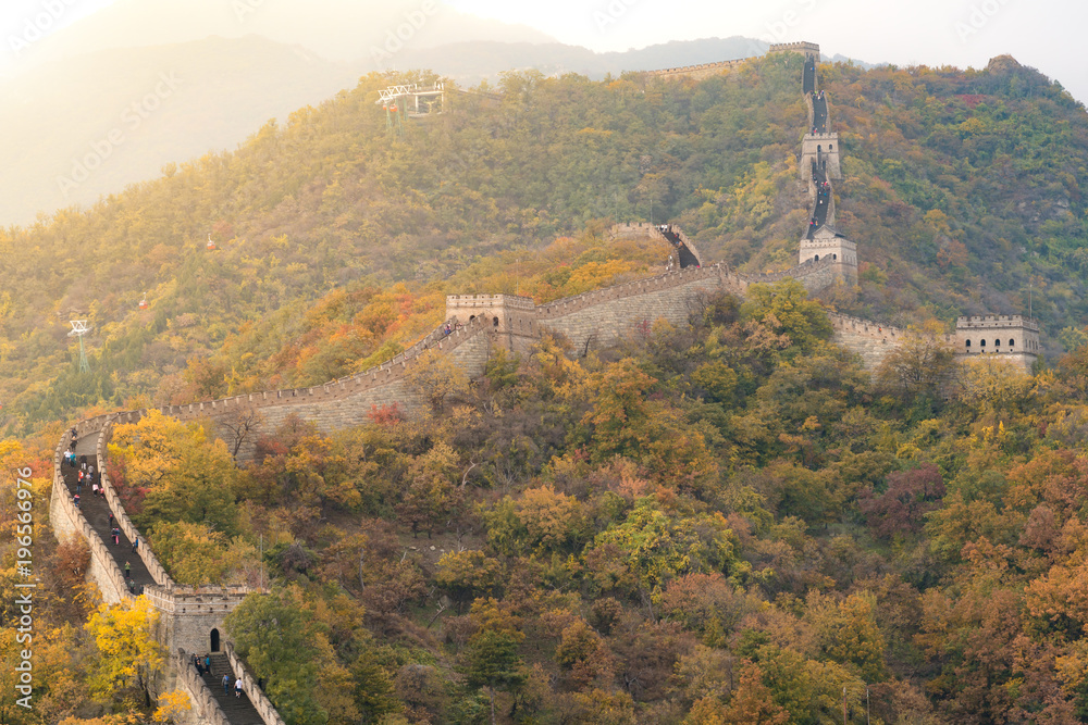 Obraz premium China The great wall distant view compressed towers and wall segments autumn season in mountains near Beijing ancient chinese fortification military landmark in Beijing, China.