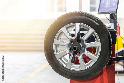 Car maintenance and service center. Vehicle tire repair and replacement equipment. Seasonal tire change