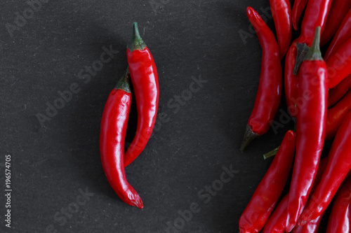 Red peppers on stone background